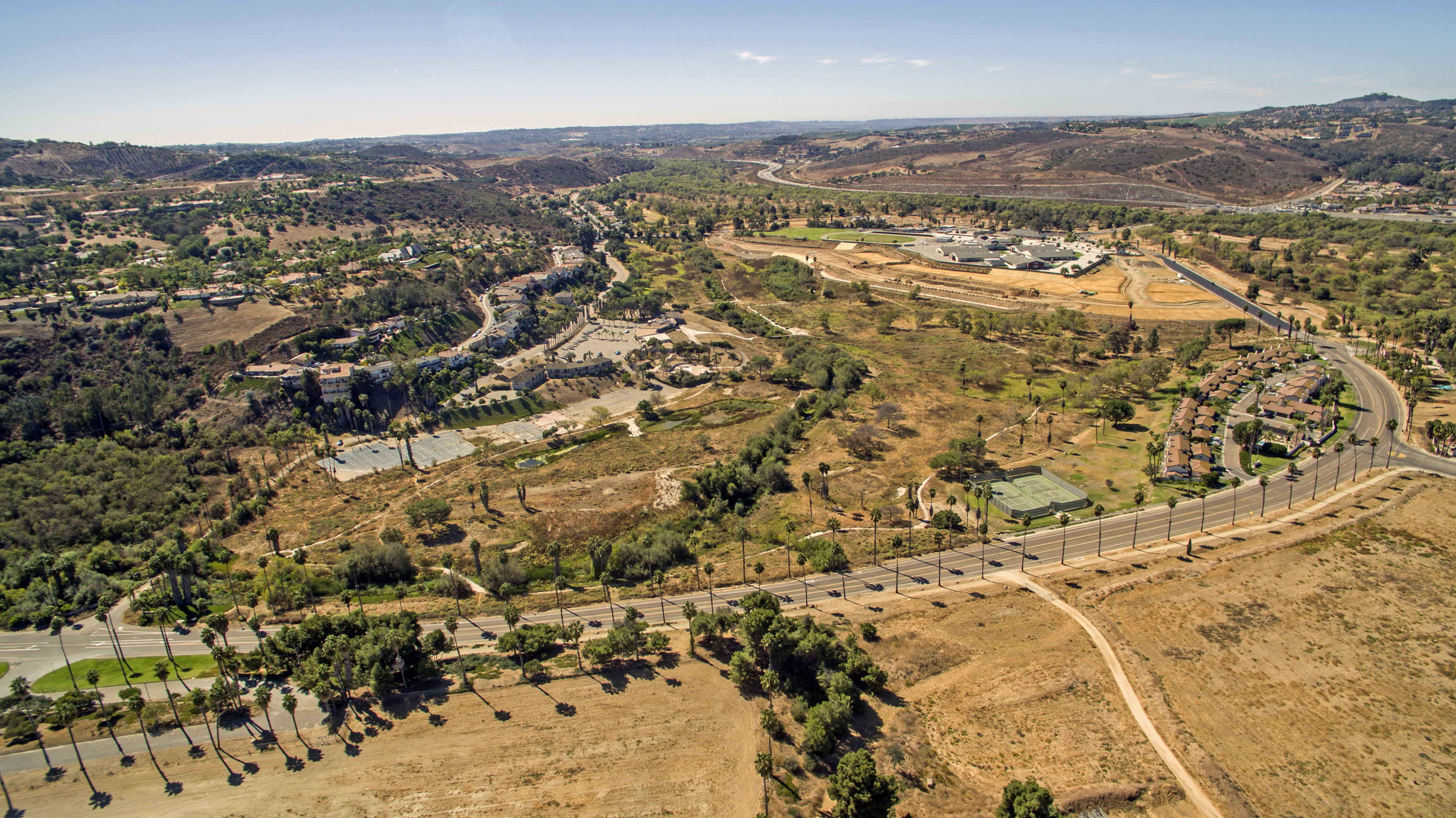 aerial photograph showing open fields and houses