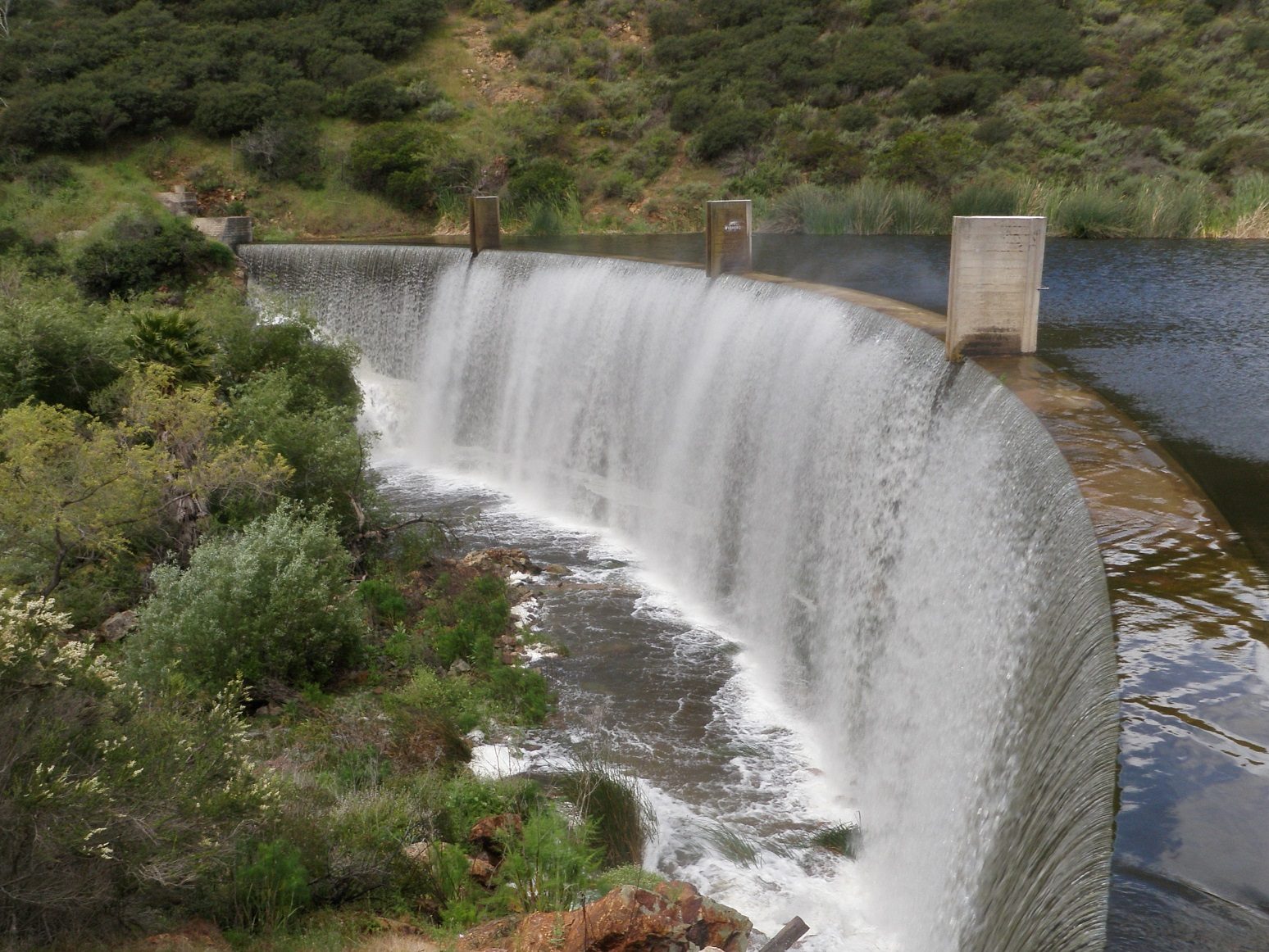 water flowing over a dam